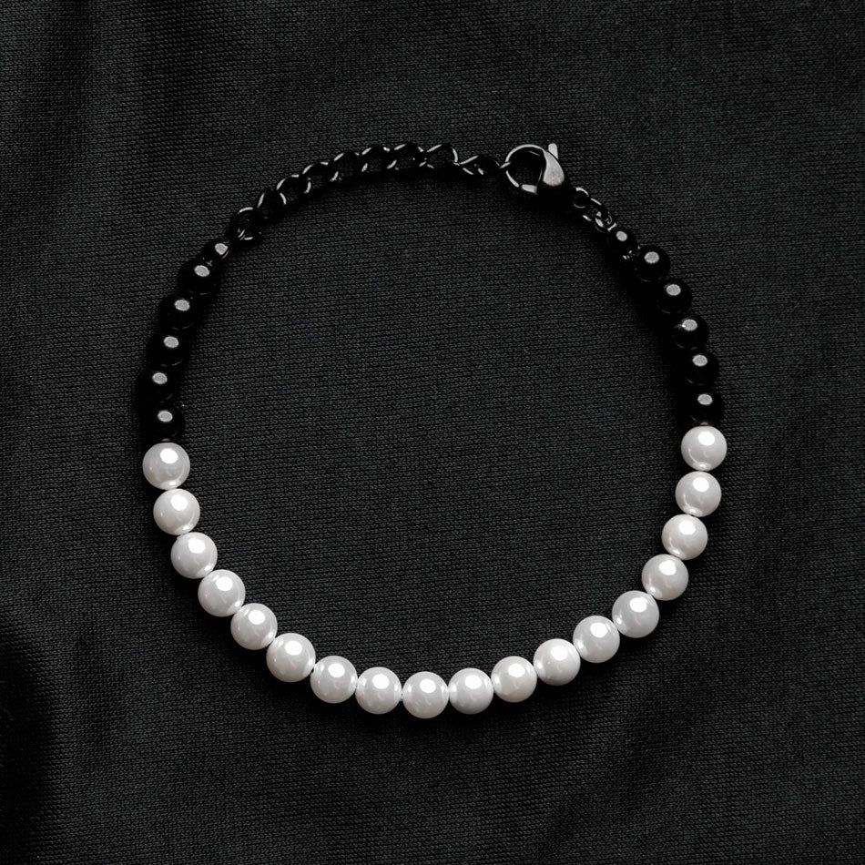Our Pearl & Black Bead Bracelet has been crafted using both polished white pearls and black beads.